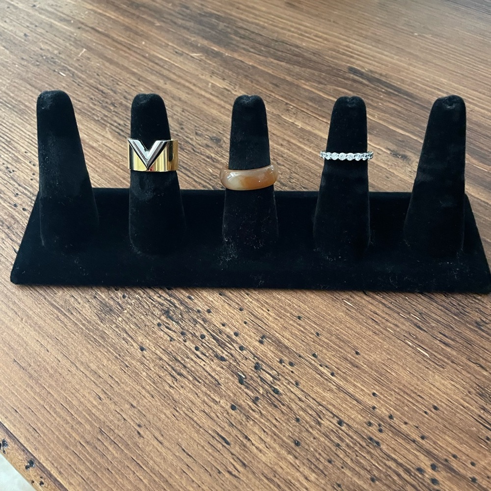 Ring display/holder.   Black velvet 5 cones.